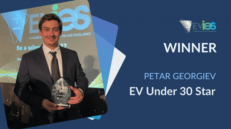 Peter Georgiev holding his Evies 2021 EV Star under 30 glass trophy